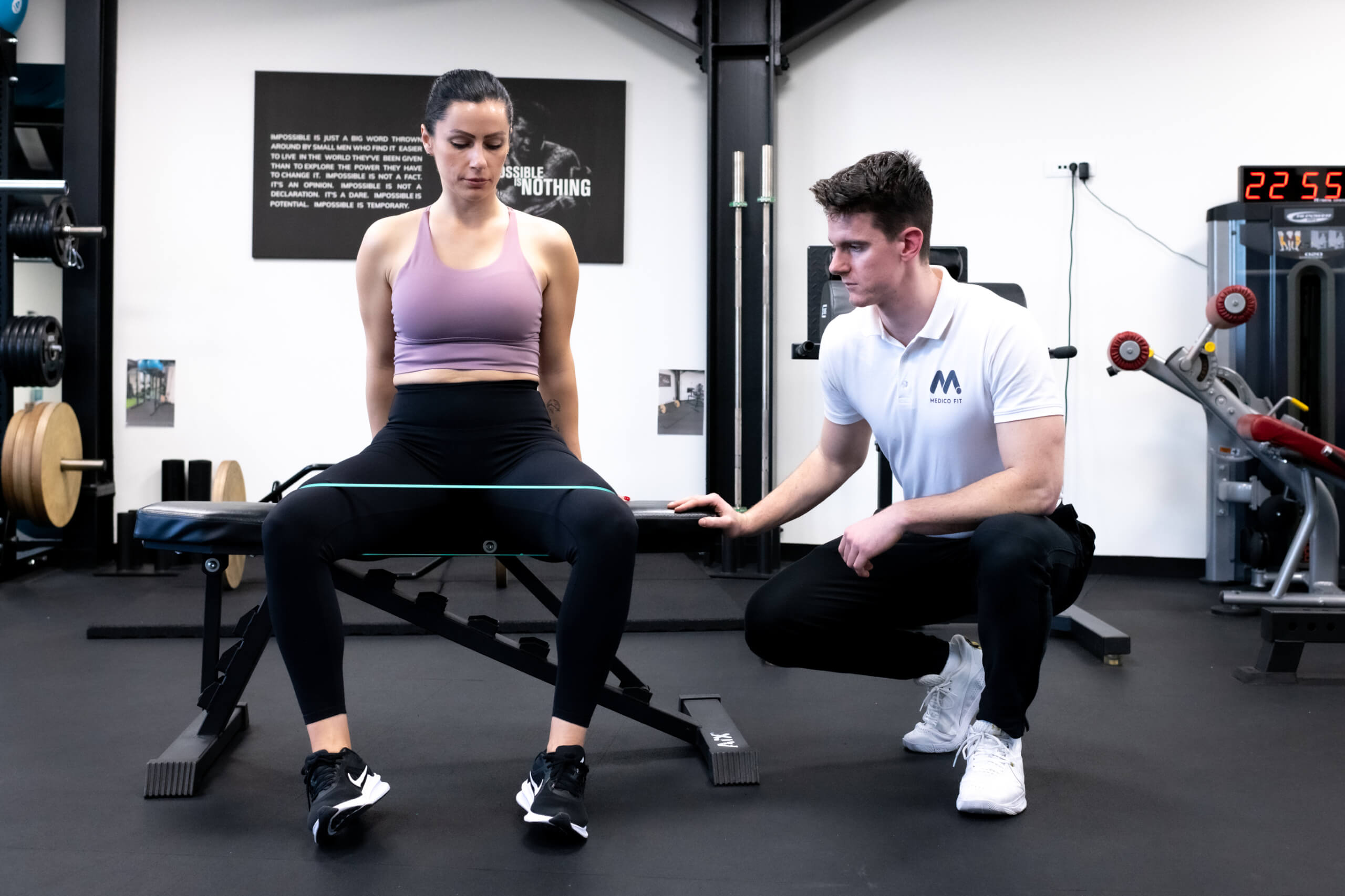 Physiotherapist and client working on her chronic back pain